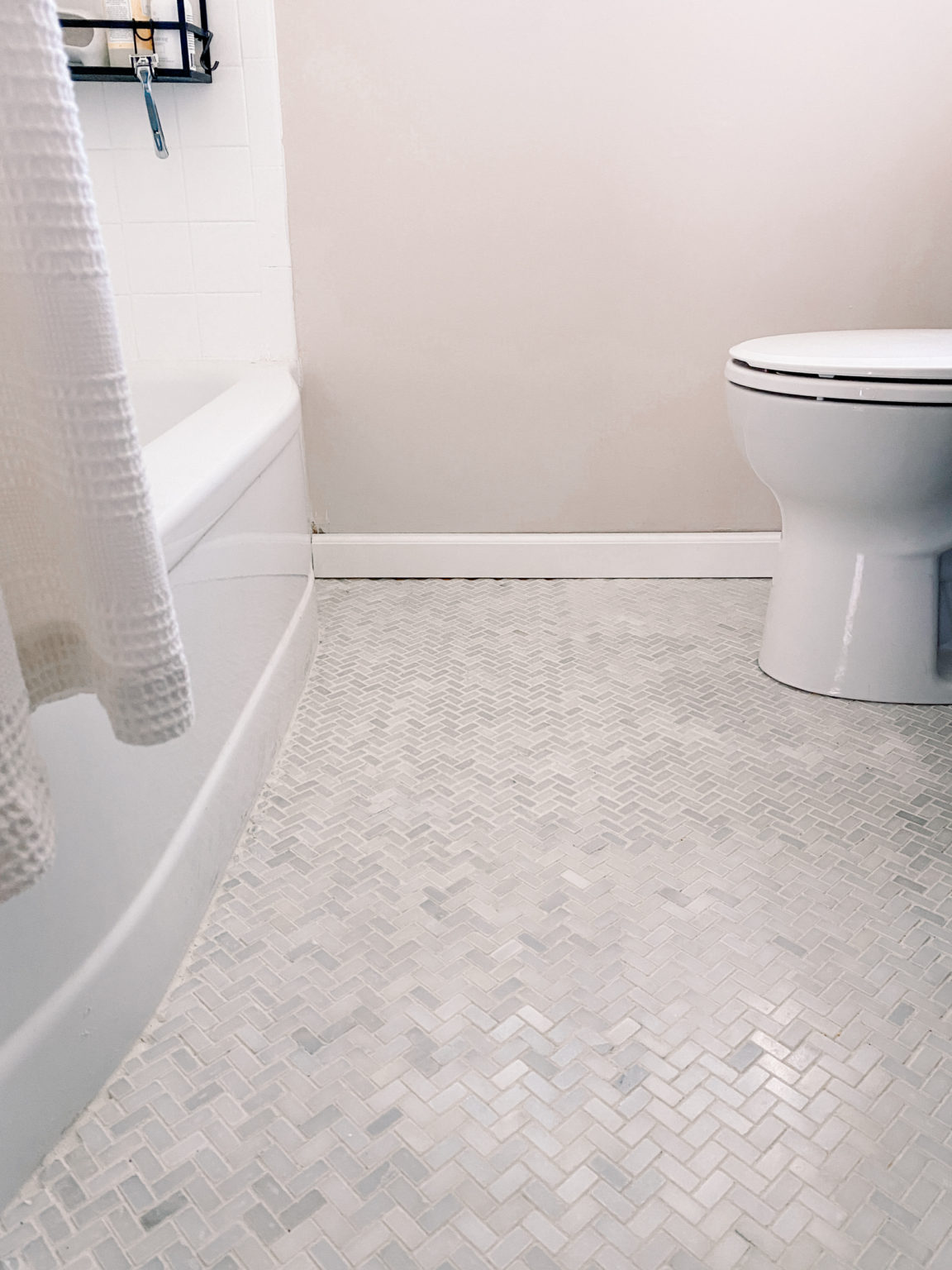herringbone floor tile bathroom