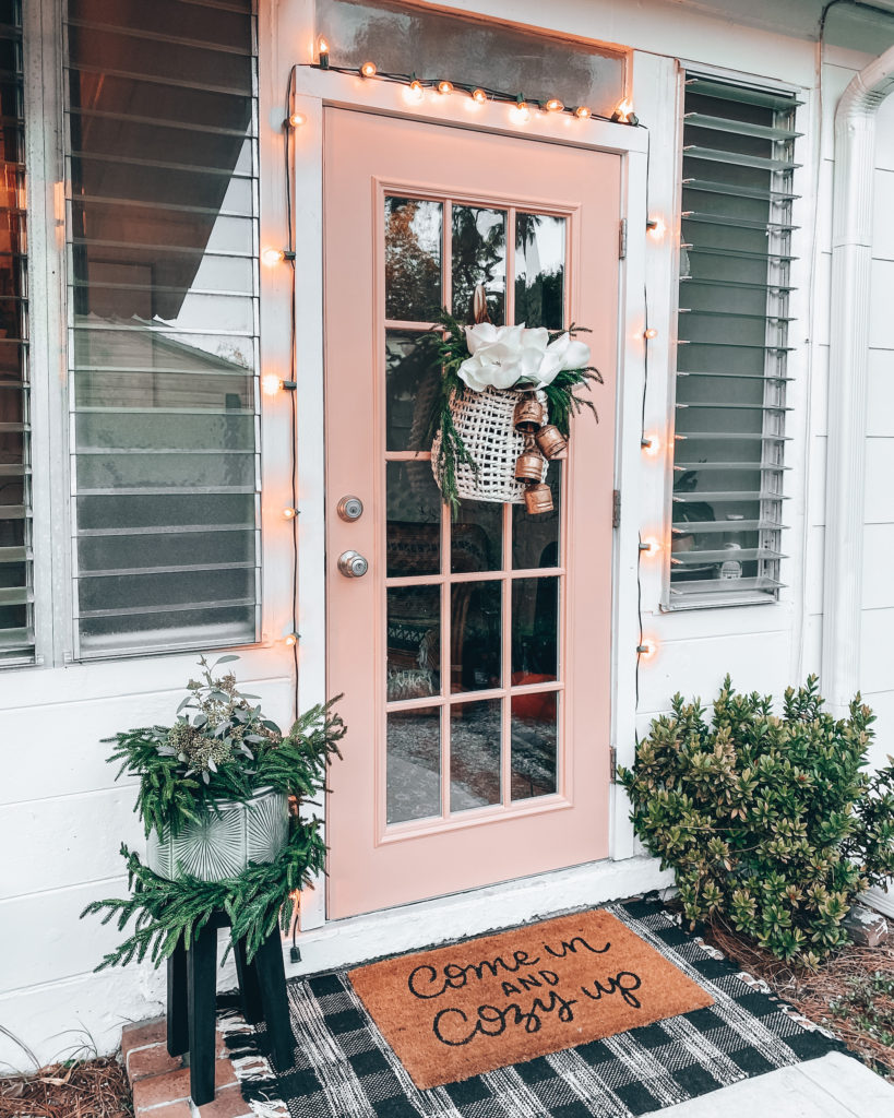 Winter front door with Christmas decor and faux flowers
