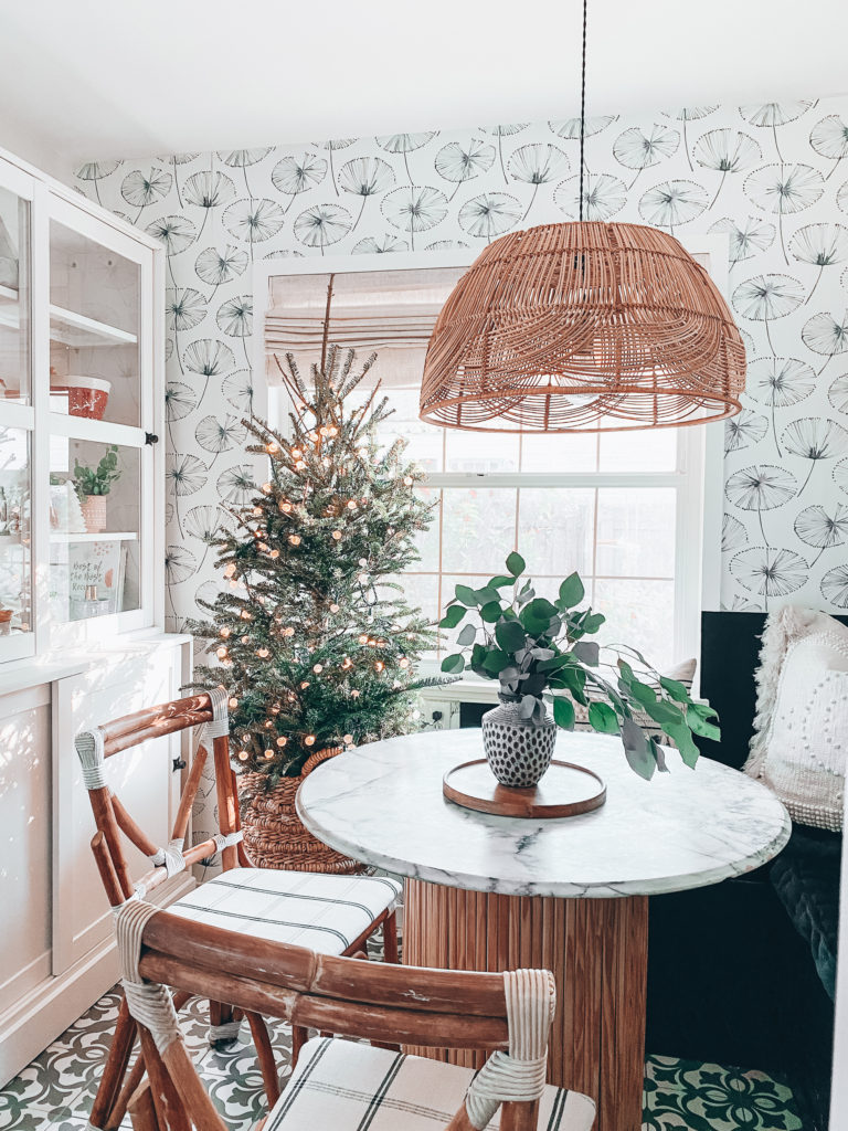 dining nook with Christmas tree and storage