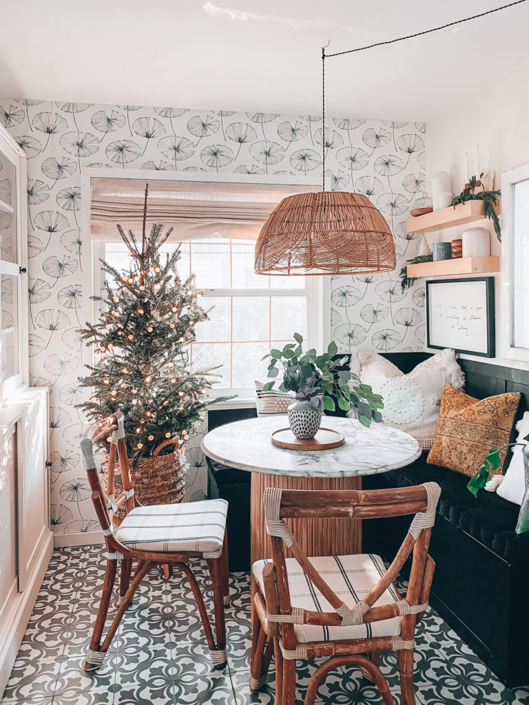 dining nook with Christmas tree and other decor