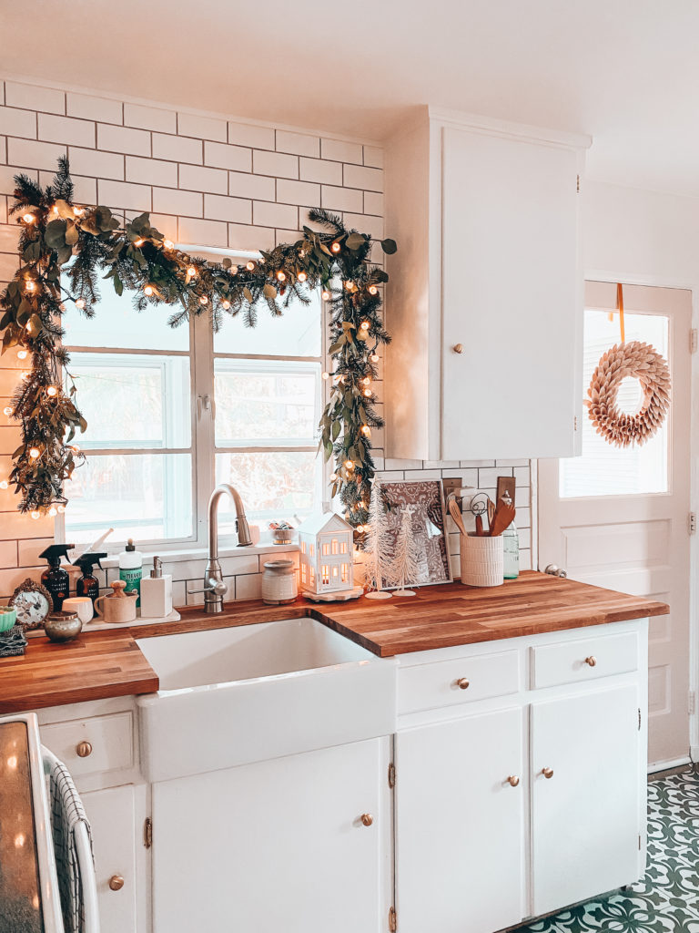 Kitchen Christmas garland over kitchen sink plus wreath