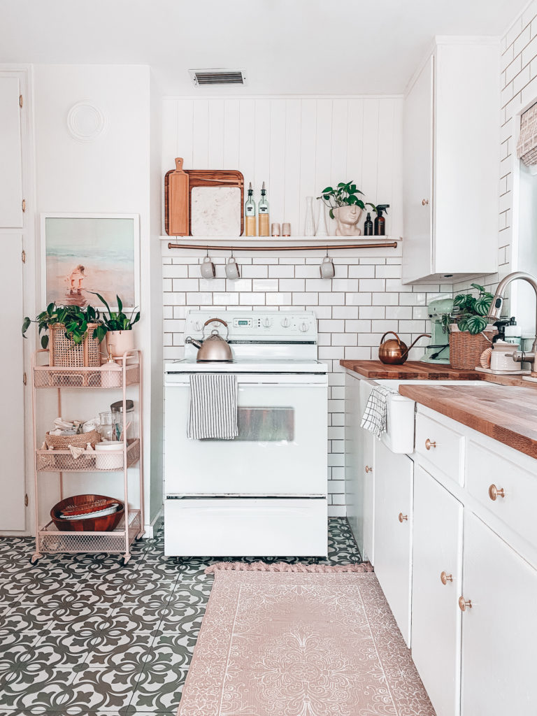 white bright kitchen warm with oven and butcher block counters