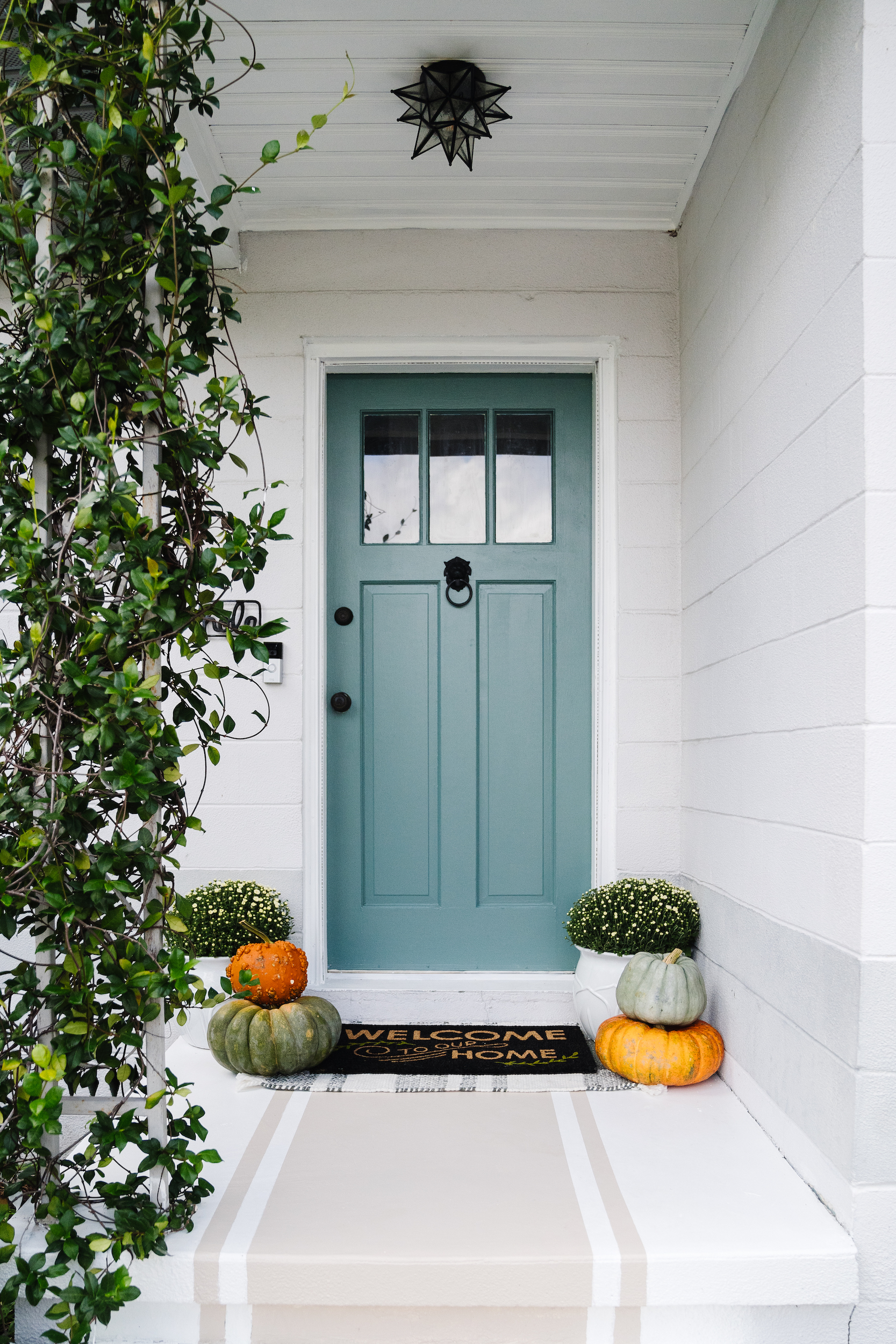 Green Front Door with Painted Striped Stairs - Blushing Bungalow