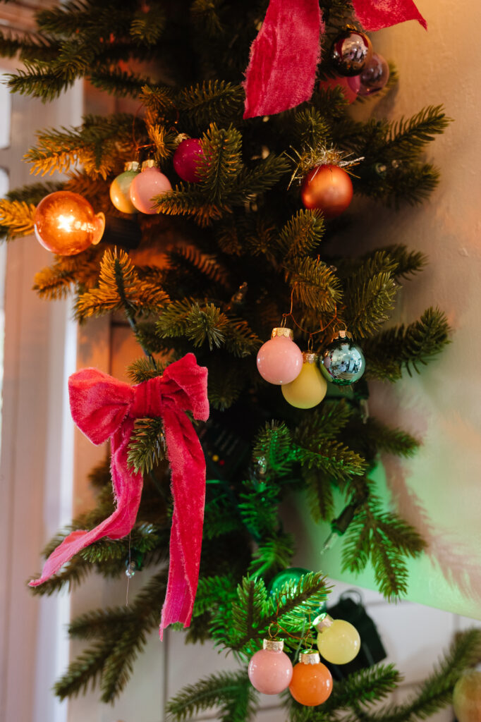 Garland hung on the banister with velvet ribbon  Velvet christmas bow,  Magnolia leaf garland, Christmas banister
