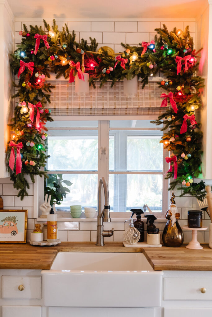 Garland hung on the banister with velvet ribbon  Velvet christmas bow,  Magnolia leaf garland, Christmas banister